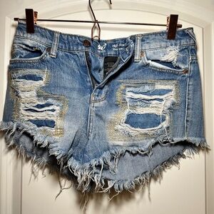 Light wash blue denim shorts from Mossino